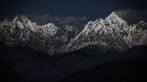 Panchachuli Peaks – Sharp snow-capped ridges emerging from shadow